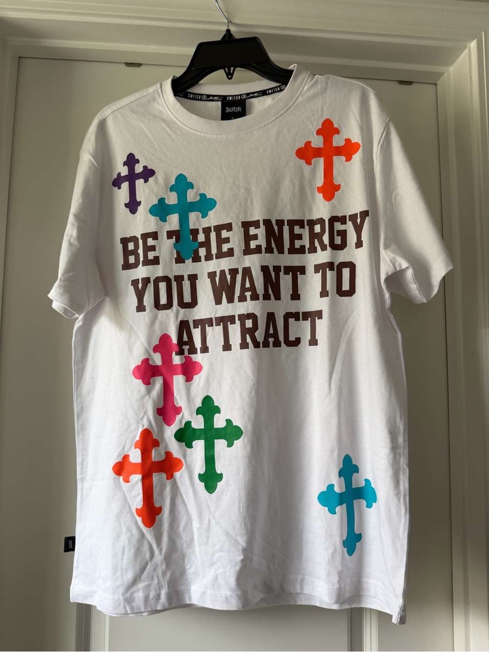 White Graphic Tee with Multicolor Cross Accents - Be The Energy - Switch